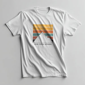 Geometric mountain silhouette over sunset colour stripes with Lone Creek Apparel text on a White graphic tee