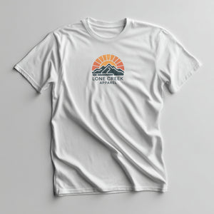 Multicolour retro sunset and mountain graphic with Lone Creek Apparel text on a White graphic tee