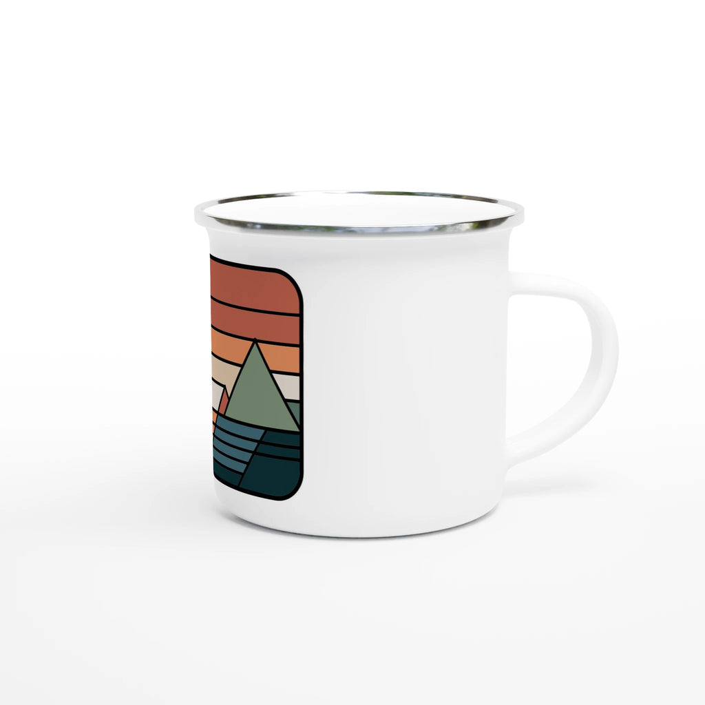 White mug with a colorful mountain design on a white background