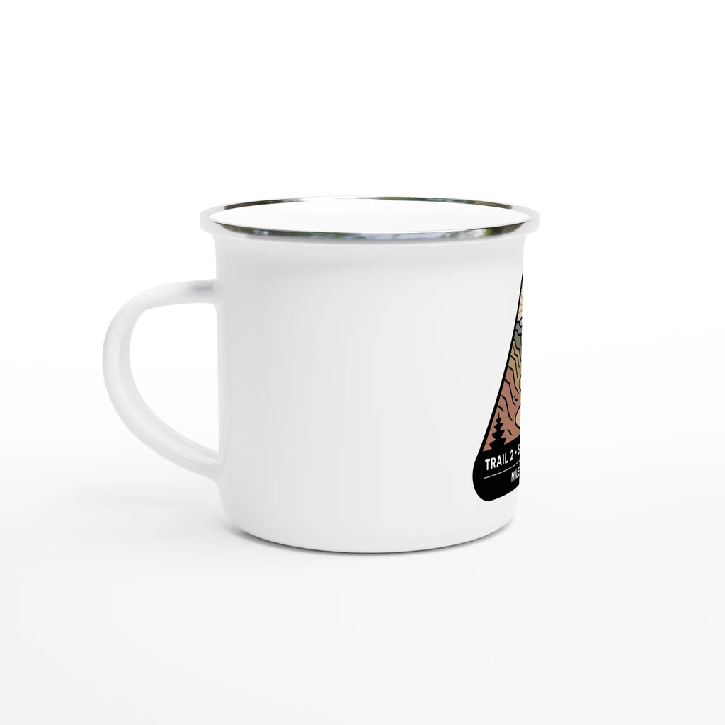 White mug with a black and brown design on a white background