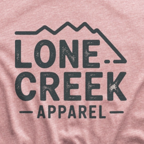 Lone Creek Apparel distressed mountain logo graphic on a heather-blend tee.