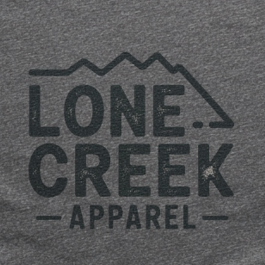 Lone Creek Apparel distressed mountain logo graphic on a heather-blend tee.