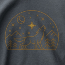 Gold line art wolf and mountain graphic on a Charcoal midweight fleece hoodie.