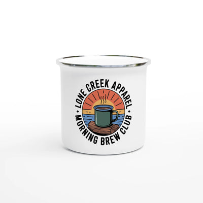 Morning Brew Club vintage badge design on a white enamel mug, featuring a sunburst, log, and water scene.