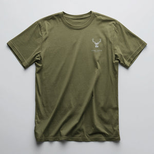 White geometric deer head graphic with Lone Creek Apparel text on a Green graphic tee