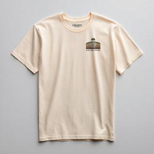 Retro tree and root cross-section graphic on a Soft Cream lightweight cotton tee.