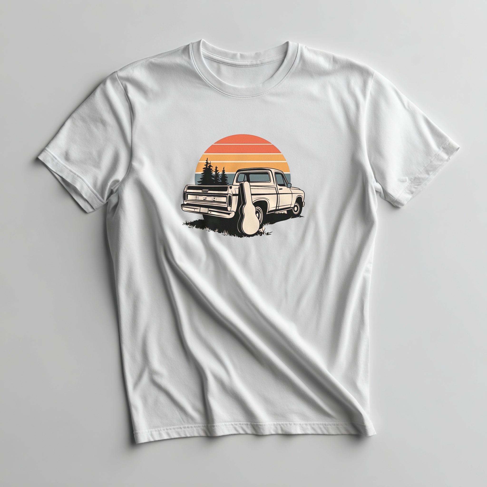 White t-shirt with a graphic of a vintage truck and sunset design on a gray background