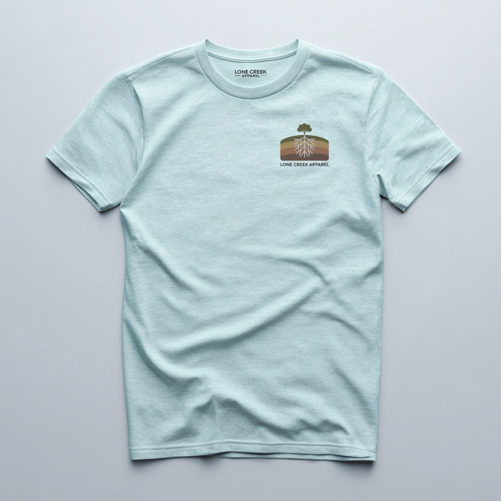 Retro tree and root cross-section graphic on a Heather Mint lightweight cotton tee.