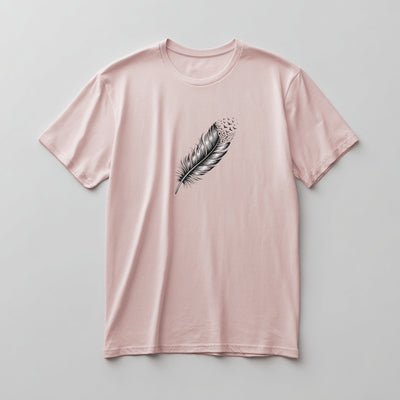 Black woodcut feather dissolving into birds graphic on a Soft Pink graphic tee