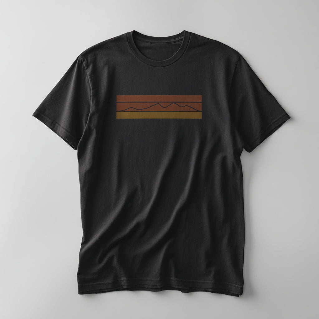 Retro striped mountain graphic in rust-red, orange, and gold on a Vintage Black graphic tee