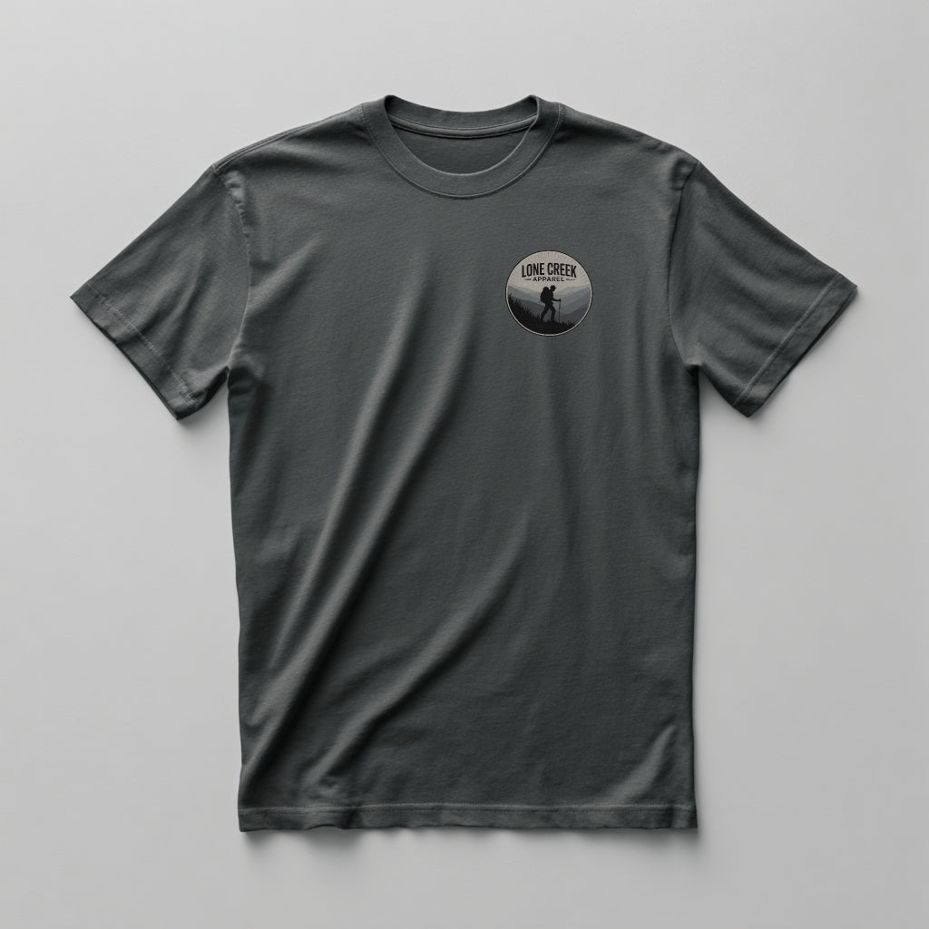 Gray t-shirt with a circular logo on the chest against a white background