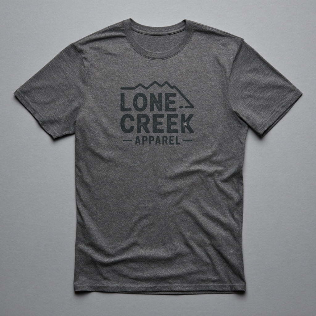 Lone Creek Apparel distressed mountain logo graphic on a heather-blend tee.