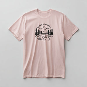 Black hand-drawn pine river scene with Embrace the Adventure text on a Pink graphic tee