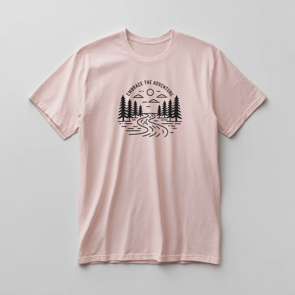 Pink t-shirt with nature graphic and 'Embrace the Adventure' text on a light gray background