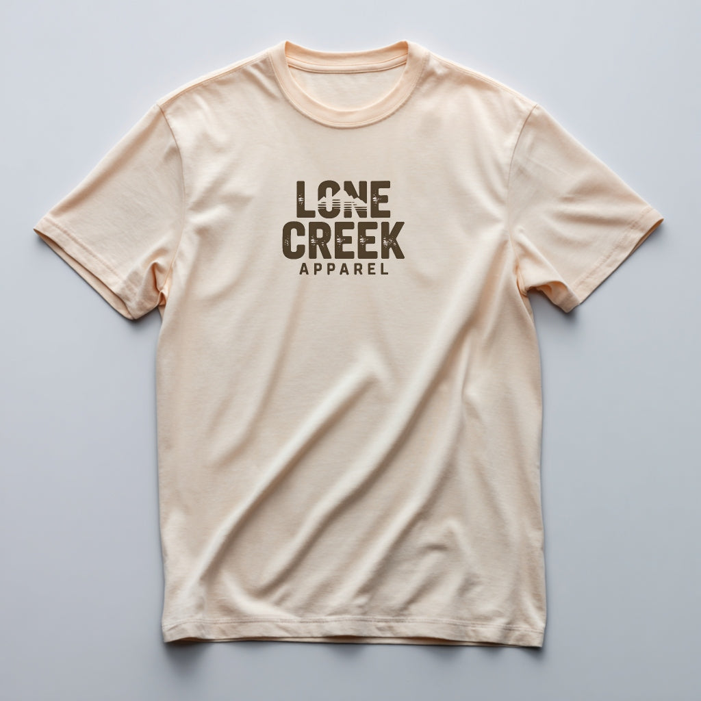 Cream t-shirt with 'Lone Creek Apparel' text on a light gray background