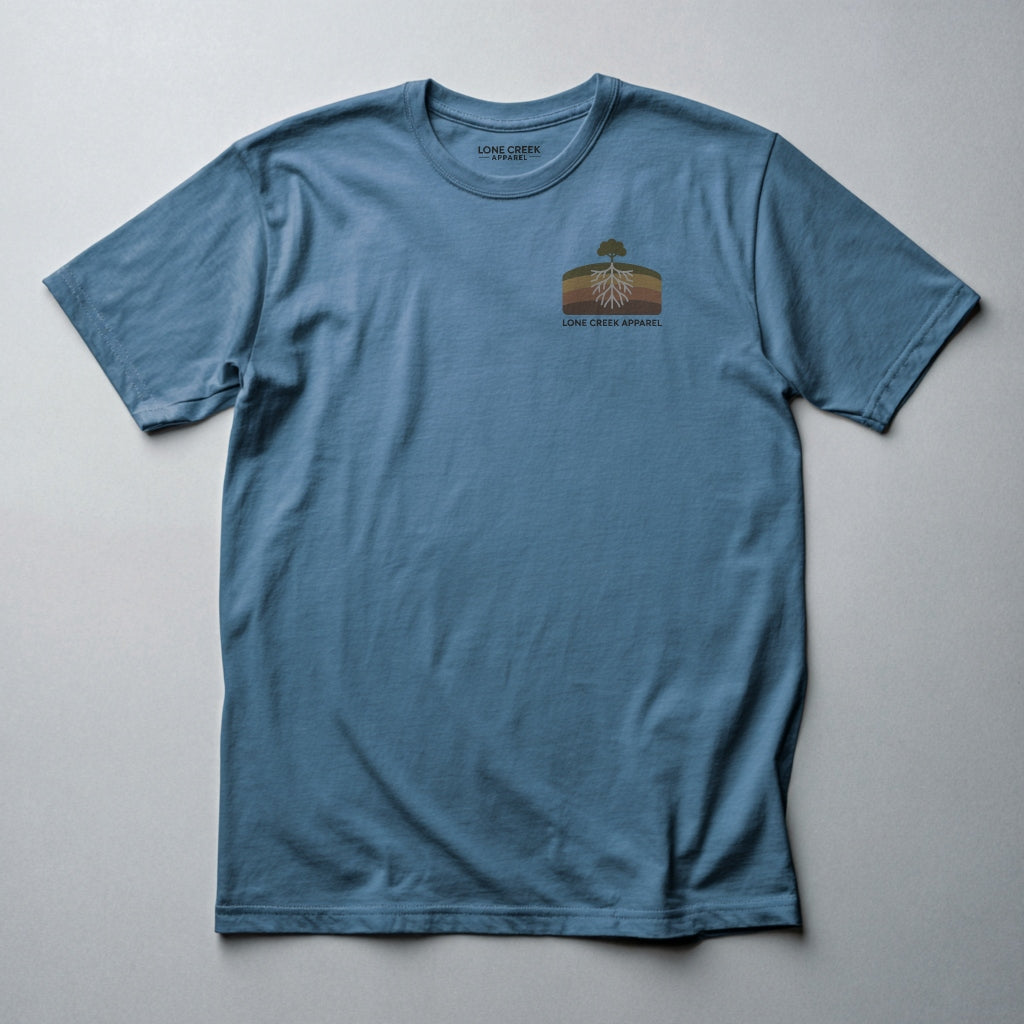 Retro tree and root cross-section graphic on a Steel Blue lightweight cotton tee.