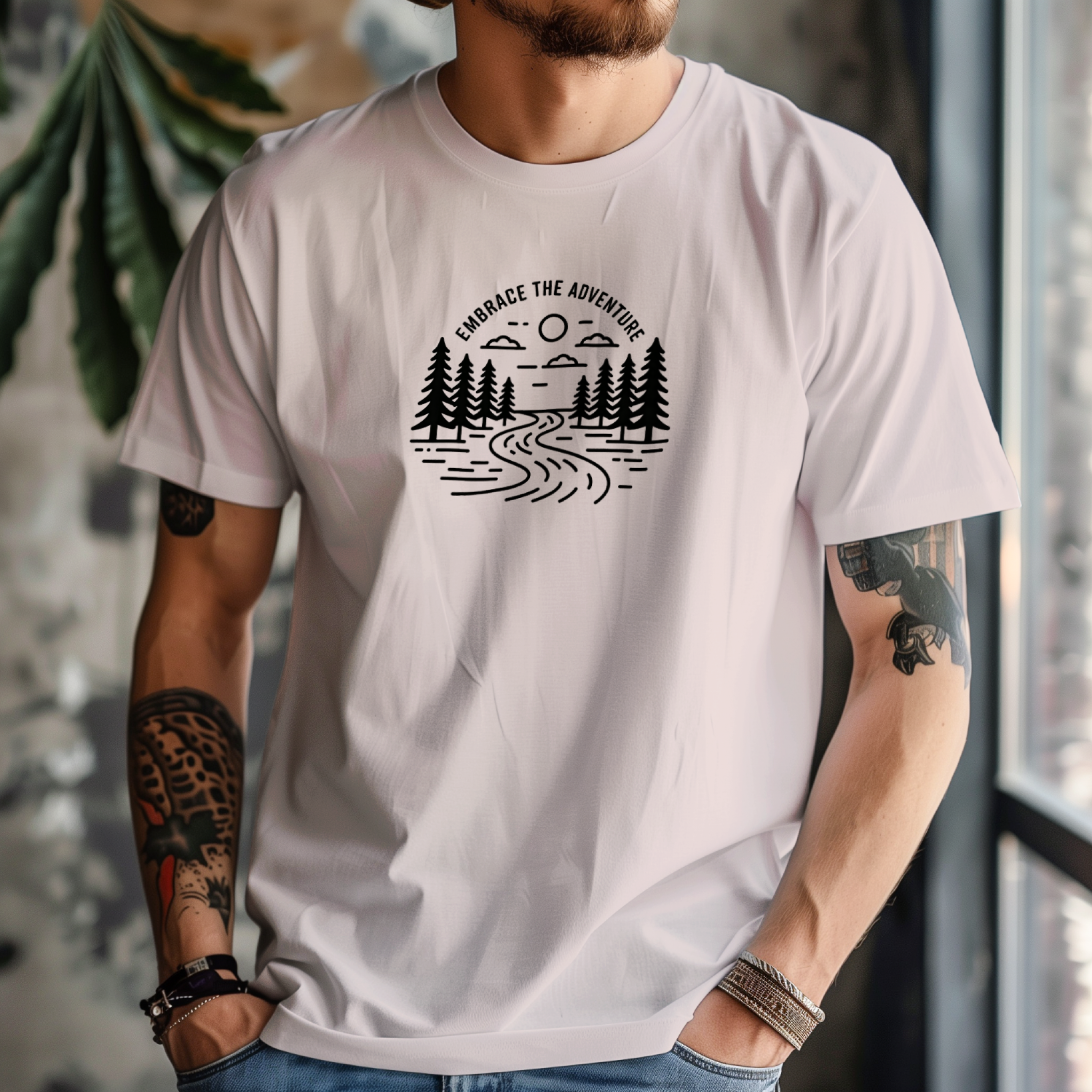 Person wearing alight pink t-shirt with a nature-themed graphic design.